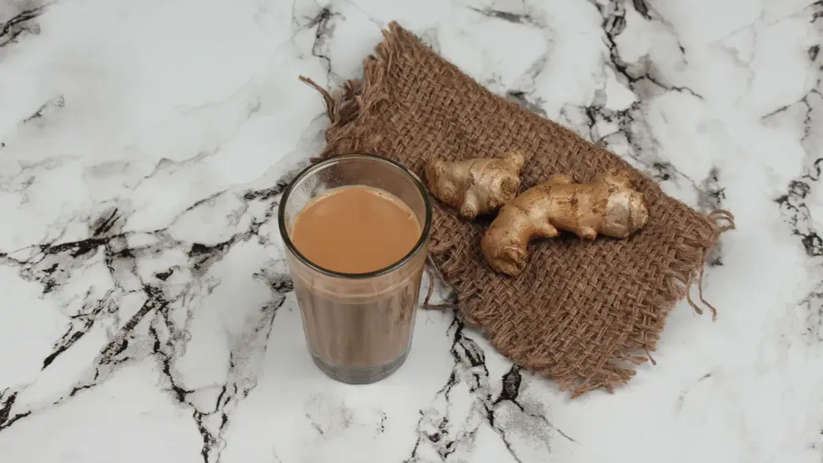 Fresh ginger tea with sliced ginger root