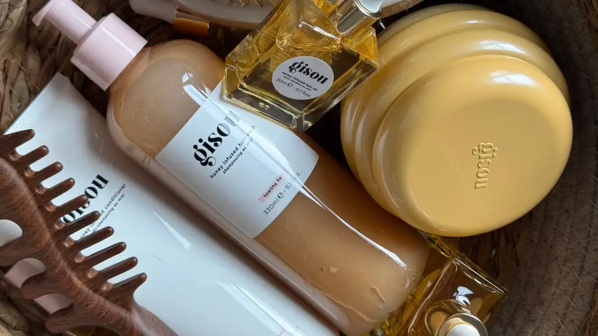 Hair care shampoo bottles on bathroom shelf
