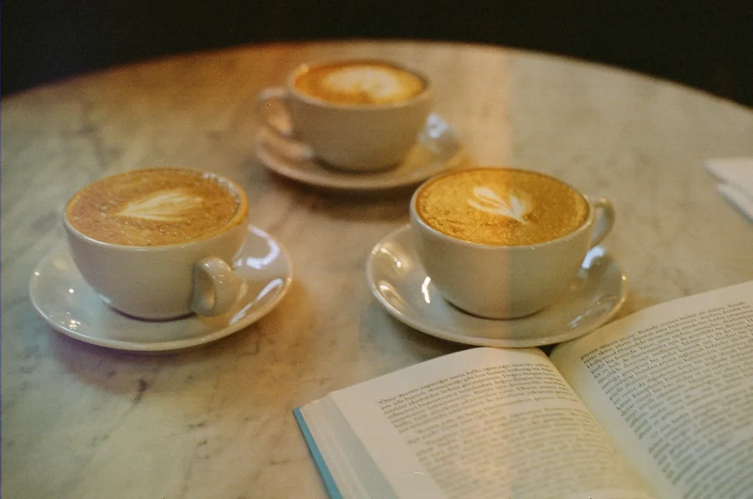 Cappuccino, latte, and macchiato lined up showing different milk levels