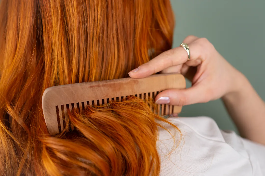 Shiny healthy red hair combed smooth in sunlight