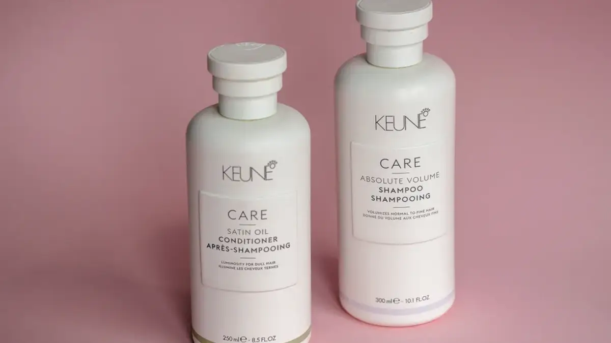 Shampoo and conditioner bottles on a shelf
